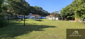 Propriedade com 6 quartos sendo 4 suítes, piscina, área gourmet e 2.034m² de terreno totalmente linear. - cska930